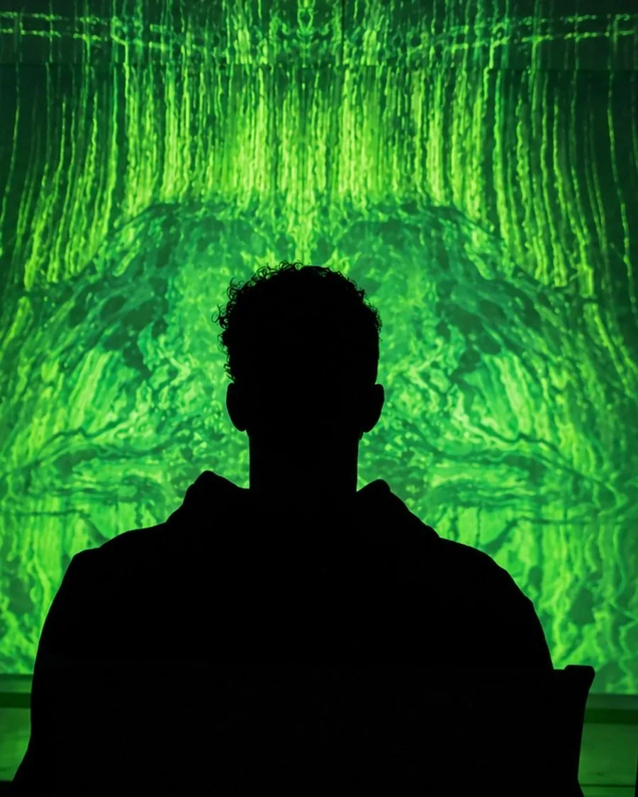 Dawn_of_Genesis// live projection — silhouette before the screen